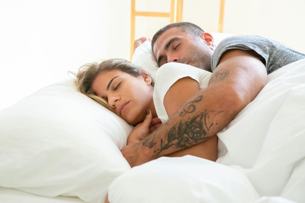 Man Huggug a Woman While Sleeping